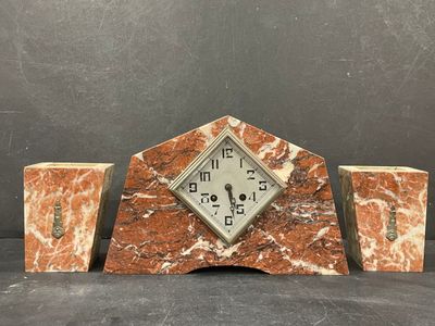 an image of a clock sitting on top of a table next to two vases