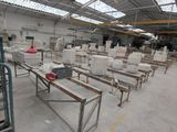 many tables and benches in a large warehouse