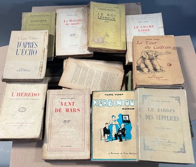 a lot of books that are sitting on a table