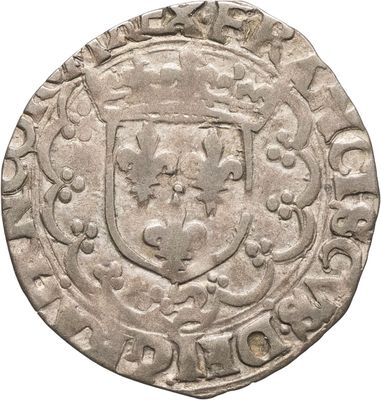 Gros plan sur une pièce de monnaie portant des armoiries