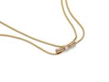 un collier en or orné d'une barre sertie de diamants, monté sur une chaîne