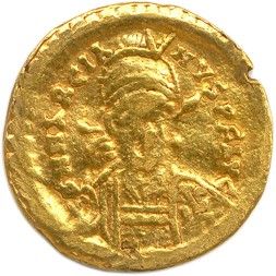 une pièce d'or à l'effigie d'une femme