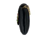 a black purse with a gold chain hanging from it ' s side