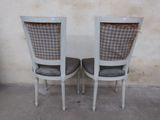 two chairs with a checkered upholstered back and seat