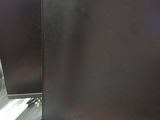 two computer monitors sitting next to each other on a desk