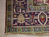 a rug on the floor with a cat sitting on it