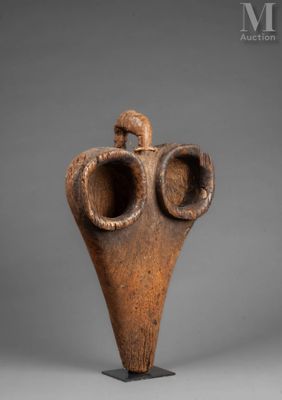 an image of a sculpture of a bird on a stand