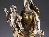a statue of a woman holding a child in her arms