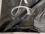 an image of a black and white flag with the letter a on it