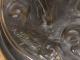 a bronze statue of a horse on a pedestal
