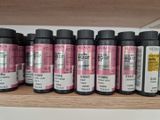 many different colors of ink on a shelf