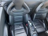 a car dashboard with two seats and a remote control