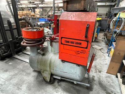 a machine that is sitting on the floor in a warehouse