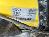 a close up of a metal object on a yellow surface