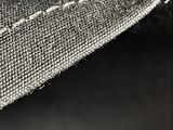 black and white photograph of a piece of fabric with a stitching pattern