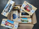 a box full of toy cars and other toys on the floor