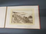 an old photo of a book opened to show a view of a beach