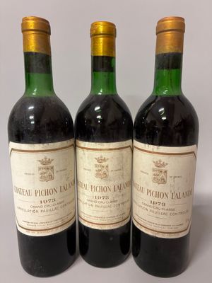 three bottles of wine sitting on top of a table next to each other