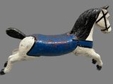 a toy horse that is painted blue and black