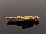 an image of a gold plated tie bar with a star wars ship on it
