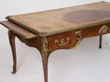 a small table with a drawer on top of it