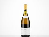 a bottle of white wine sitting on top of a table