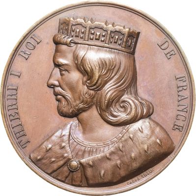 une image montrant un gros plan d'une médaille sur fond blanc