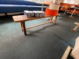 a blue couch and a wooden table in a room