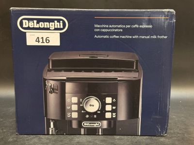 packaging of delonghi coffee machine on table with black background