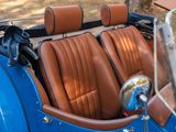 a close up of a blue and brown car with leather seats