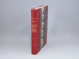 a red book that is sitting on a table