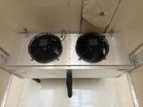 two fans that are sitting on top of a metal box