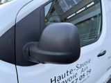 a white van parked on the side of the street