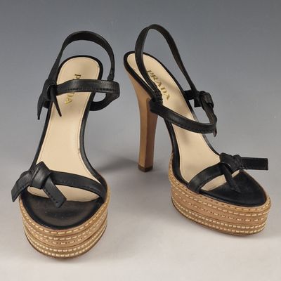 pair of women ' s black leather platform sandals with wooden heel