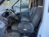 a white van with a black seat in the back of it