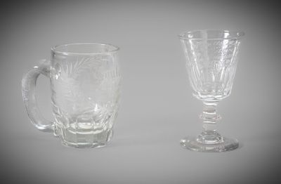 two glass cups sitting next to each other on a table