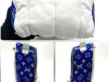 a picture of a blue and white louis vu bag