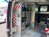 an image of the inside of a van with the door open