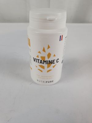 a close up of a container of vitamin g on a table