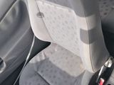a seat in the back of a car with a seat belt