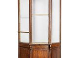 an old wooden display case with glass doors on a white background