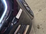 a close up of a car with a sticker on it ' s bumper