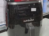 a black and red blender sitting on a counter