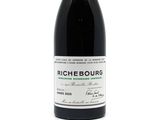 a bottle of wine that is sitting on a table