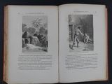 an open book with a picture of a man and a woman sitting on a bench