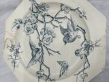 a white plate with a blue and white design on it