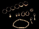 an assortment of gold jewelry including rings, bracelets, and rings