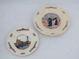 two plates with pictures of people on them on a table