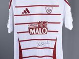 a white shirt with a red and white stripe on it