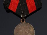 a close up of a medal on a black background